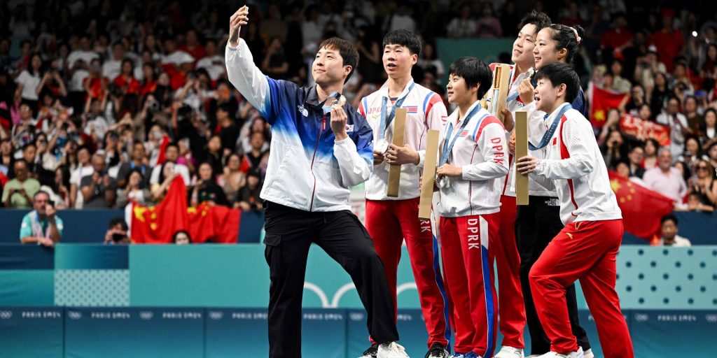 Billedet af de koreanske medaljevindere blev en sensation: Nu kan selfien give problemer for to af dem